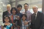 HEADWATERS’ GOVERNANCE Committee Chair Lori Kerr (back left) and Dr. David Scott (far right) present Drs. Stephen and Stephanie Milone, and their children, with the 2017 Dr. David Scott Award in a special ceremony at Headwaters Health Care Centre’s AGM, Monday.