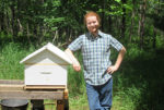 KEVIN CATANIA WITH ONE of his two bee hives in his backyard. Raising over 3000 honeybees, he is looking to help increase the insects’ population, have a better environment, learn a bit about their importance to the environment, and get some fresh honey.